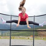 Teenage girl jumping on a trampoline