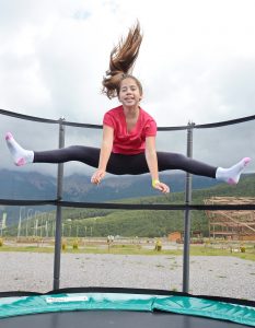 Teenage girl jumping on a trampoline