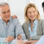 19500076 – portrait of happy senior couple talking with a young man